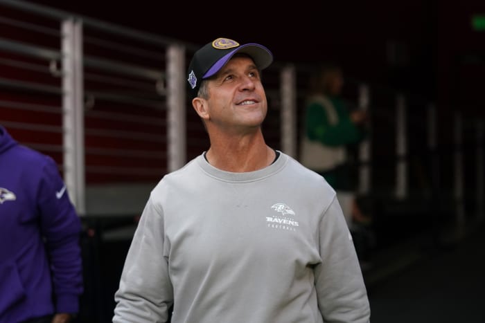 Baltimore Ravens head coach John Harbaugh walks onto the field
